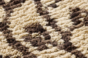 Eucalyptus Embrace Dark Brown Rug Art shown from a different angle to reveal its pattern.