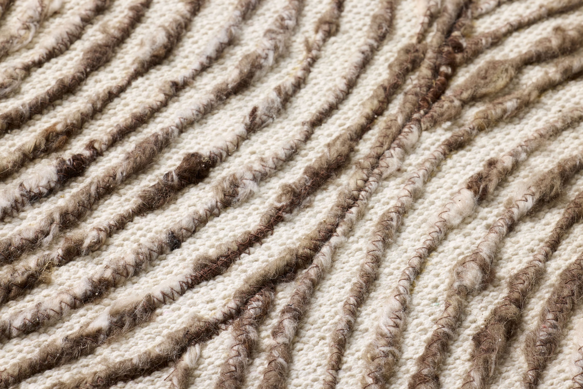 Phase Dark Brown Rug Art shown from a different angle to reveal its pattern.