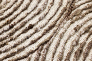 Phase Dark Brown Rug Art shown from a different angle to reveal its pattern.