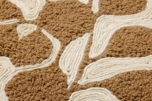 Sprig & Soil Brown Rug Art shown from a different angle to reveal its pattern.