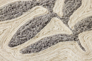 Stem & Stone Grey Rug Art shown from a different angle to reveal its pattern.