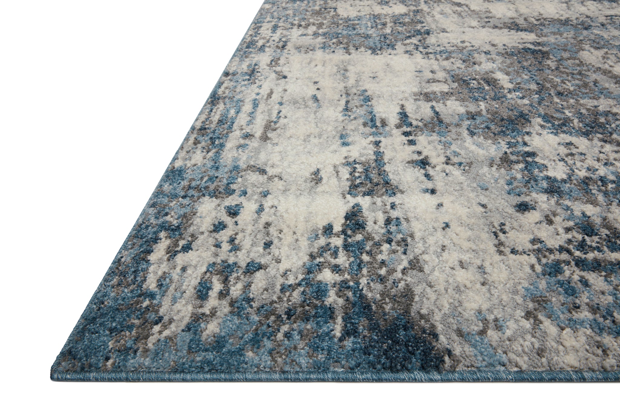 Side view of the Austen Natural / Ocean rug.