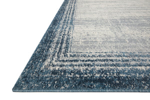 Side view of the Austen Pebble / Blue rug.