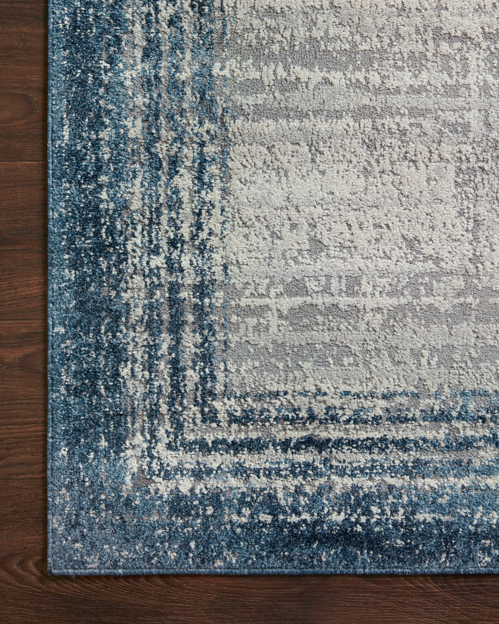 Austen Pebble / Blue styled in a living room at Laurie Yapp Home.