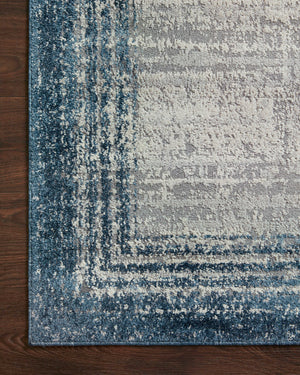 Austen Pebble / Blue styled in a living room at Laurie Yapp Home.