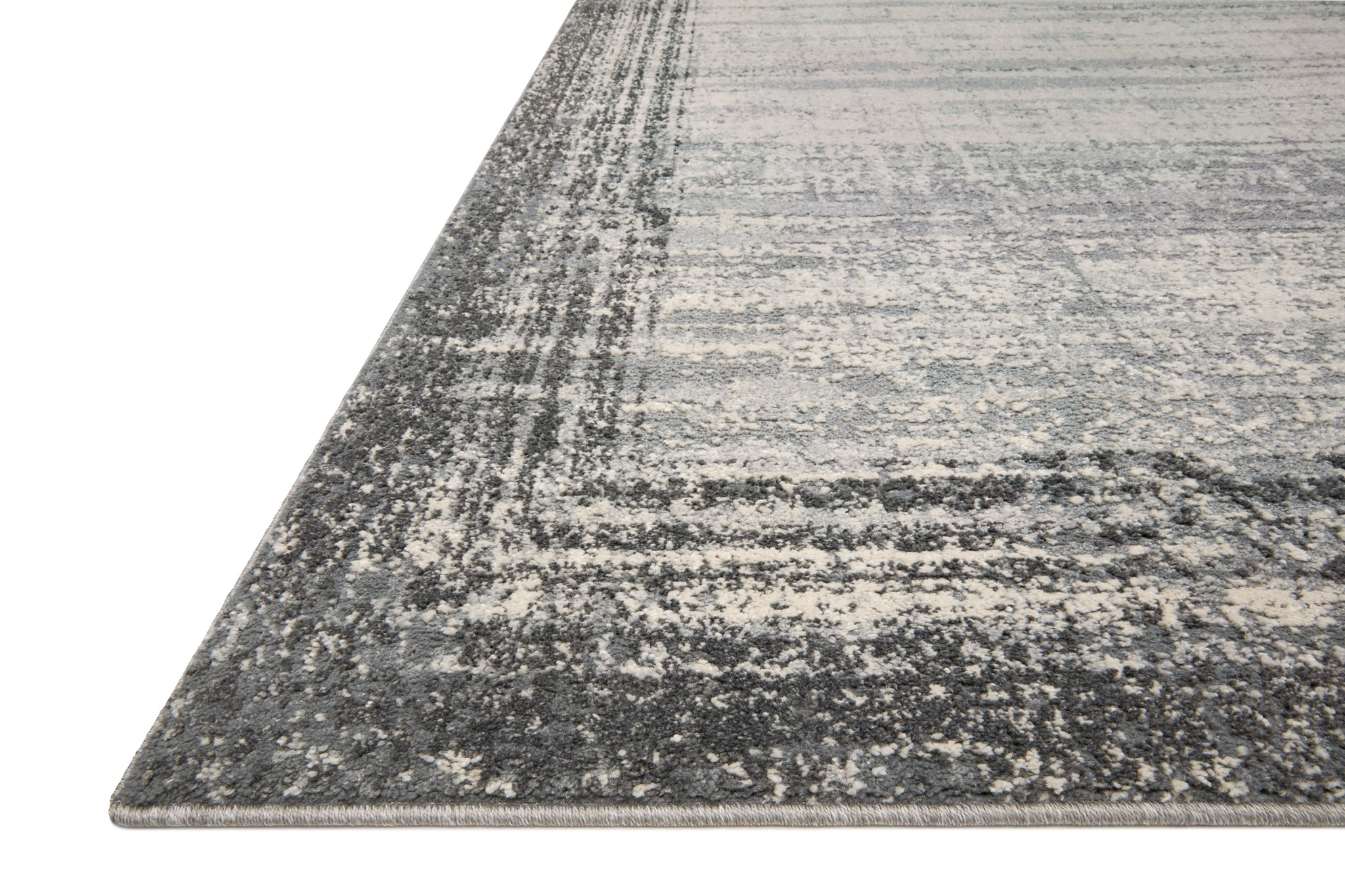 Side view of the Austen Pebble / Charcoal (Pattern 2) rug.