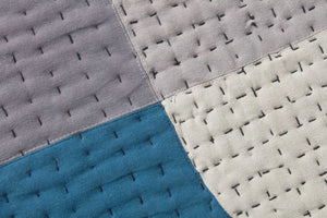 Bullet Point Blue / Grey Rug Art shown from a different angle to reveal its pattern.