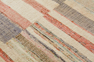 Beach Day Multi / Beige Rug Art shown from a different angle to reveal its pattern.