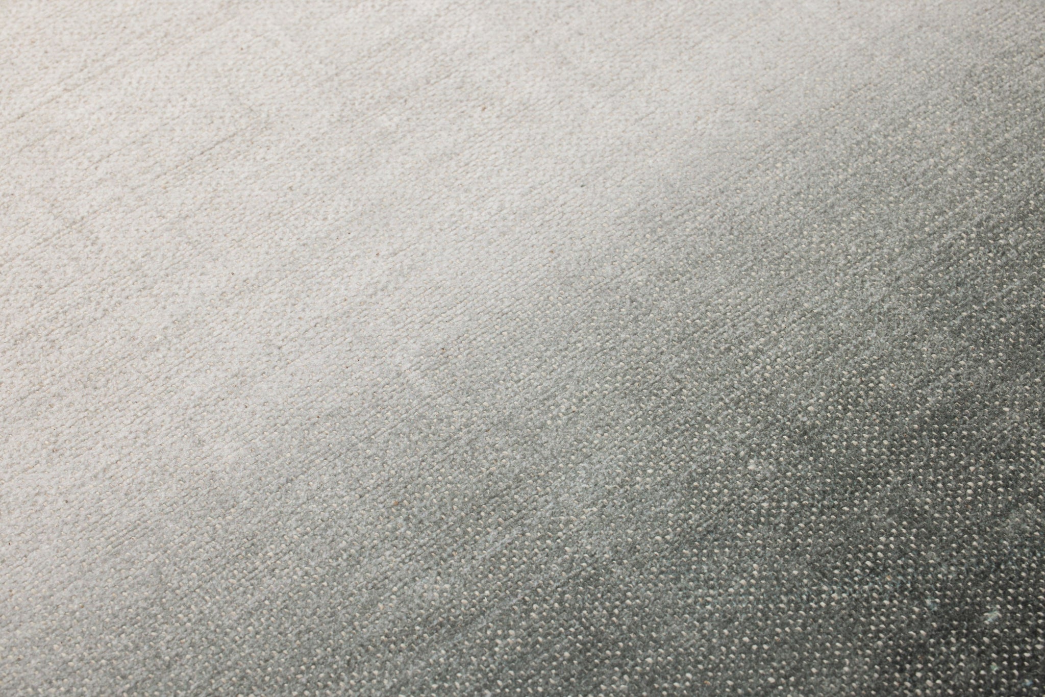 Plutus Green / Beige Rug Art shown from a different angle to reveal its pattern.