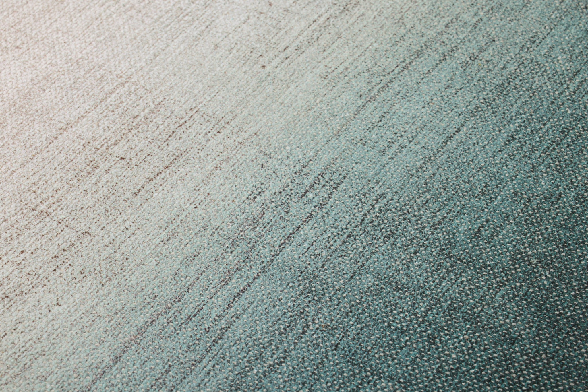 Posei Green / Blue Rug Art shown from a different angle to reveal its pattern.