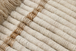 All Coiled Up Ivory / Natural Rug Art shown from a different angle to reveal its pattern.