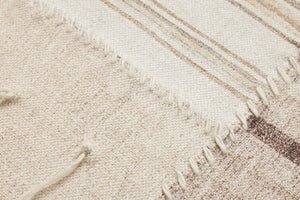 Renewed Beige / Brown Rug Art shown from a different angle to reveal its pattern.