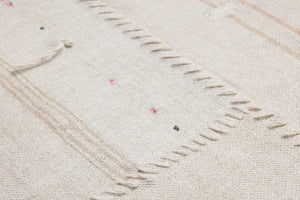 Rejuvinated Beige / Brown Rug Art shown from a different angle to reveal its pattern.