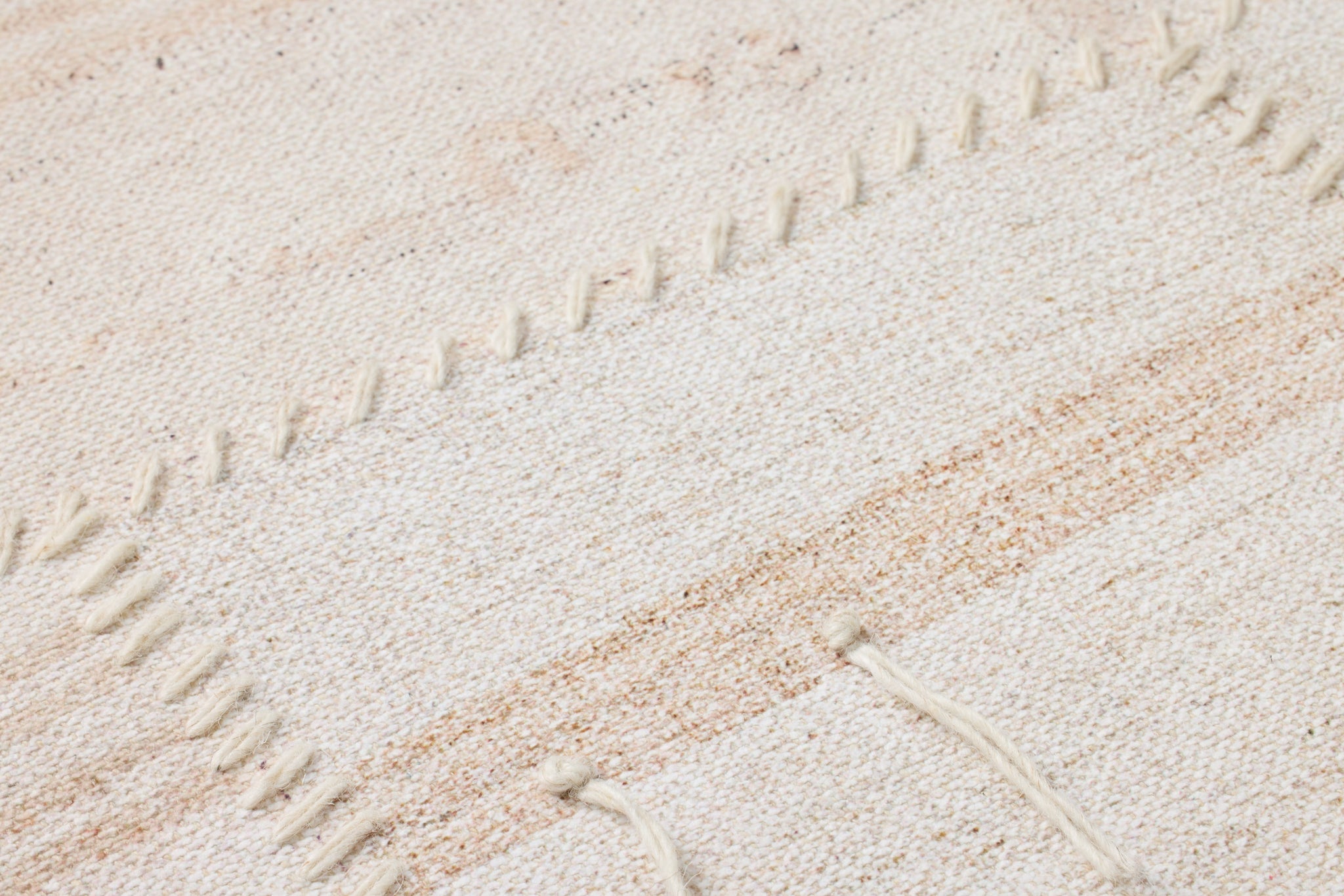 Reimaged Beige / Ivory Rug Art shown from a different angle to reveal its pattern.