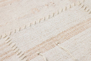 Reimaged Beige / Ivory Rug Art shown from a different angle to reveal its pattern.