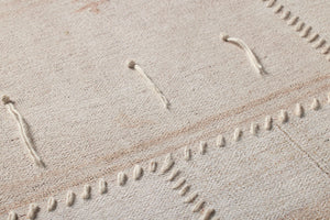 Revived Beige / Ivory Rug Art shown from a different angle to reveal its pattern.