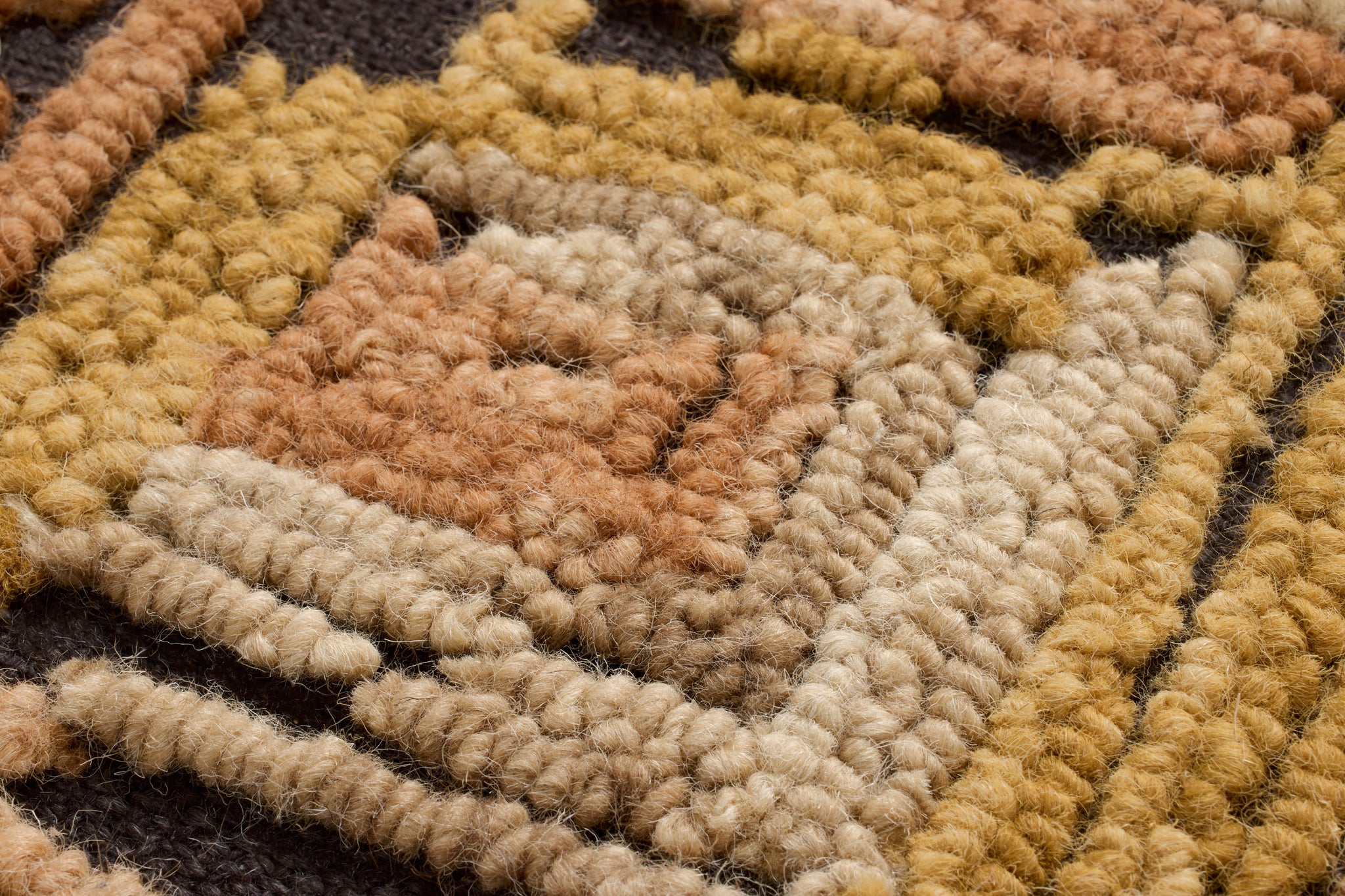 Intersecting Gold / Orange Rug Art shown from a different angle to reveal its pattern.