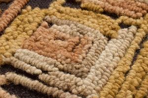 Intersecting Gold / Orange Rug Art shown from a different angle to reveal its pattern.