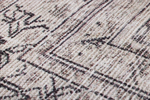 Aleppo Black / Ivory Rug Art shown from a different angle to reveal its pattern.