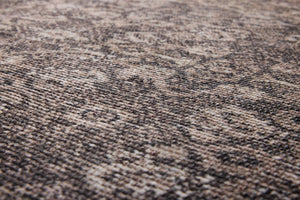Persepolis Brown / Black Rug Art shown from a different angle to reveal its pattern.