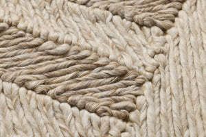 Bandera Beige / Ivory Rug Art shown from a different angle to reveal its pattern.