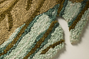Palmera Green / Brown Rug Art shown from a different angle to reveal its pattern.