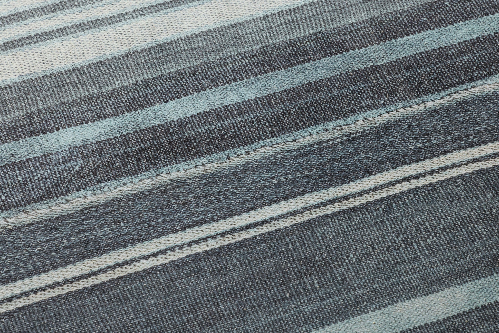 Flow Lt Grey Rug Art shown from a different angle to reveal its pattern.