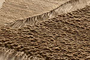 Field Natural Rug Art shown from a different angle to reveal its pattern.