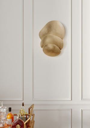 Akemi Wall Sconce styled in a warmly lit hallway for warm, layered light at Laurie Yapp Home.