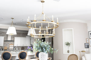 Allendale Chandelier 46.75" x 38" in aged brass styled in an elegant dining room for warm, layered light at Laurie Yapp Home.