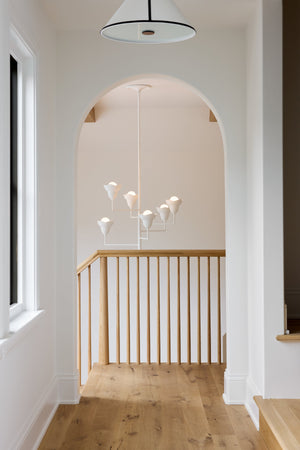 Alora Chandelier 32" styled in a two-story entry for warm, layered light at Laurie Yapp Home.