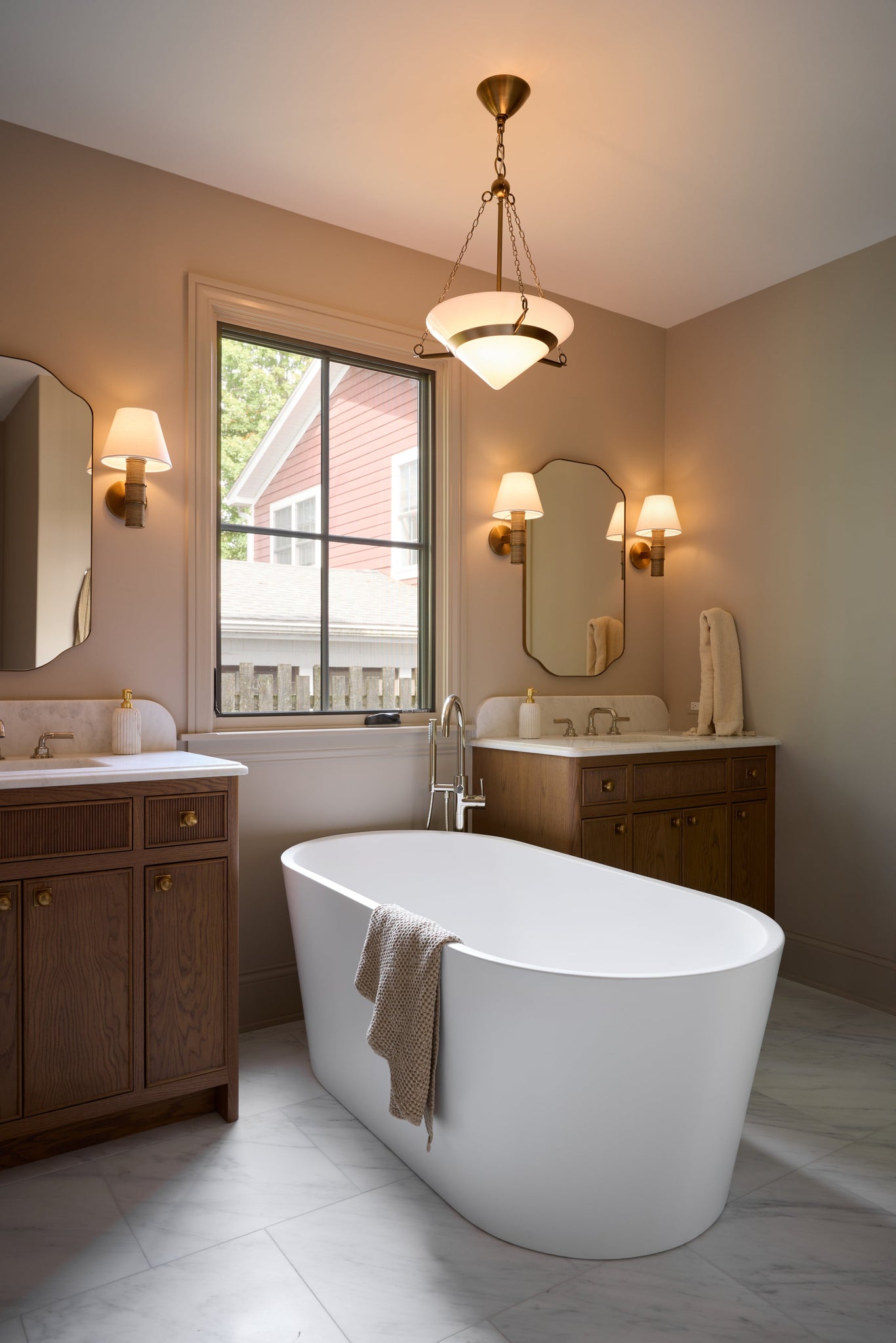 Denton Wall Sconce styled in a curated living room for warm, layered light at Laurie Yapp Home.