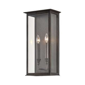 Chauncey Exterior Wall Sconce 9.5" x 19" styled in a warmly lit hallway for warm, layered light at Laurie Yapp Home.