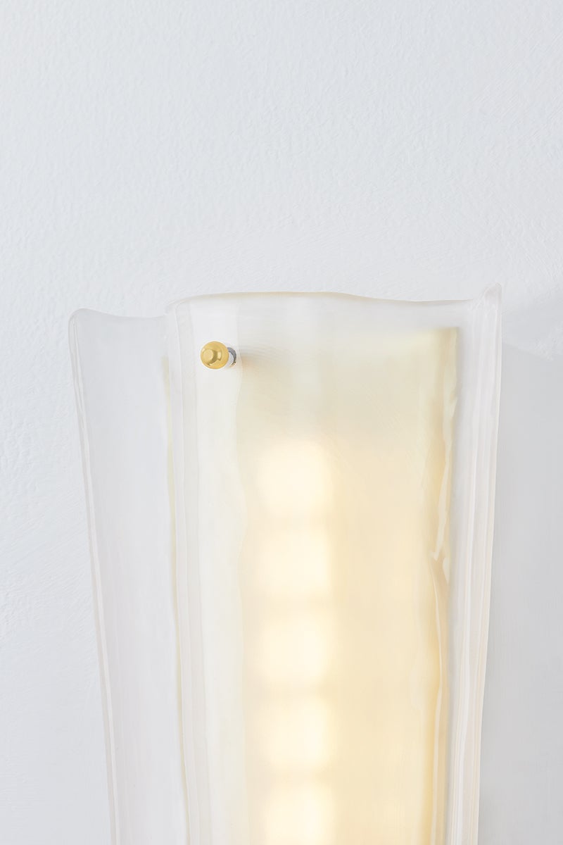 Baxford Wall Sconce in aged brass shown from the front to reveal the arm curve and shade silhouette.