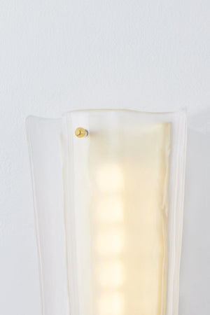 Baxford Wall Sconce in aged brass shown from the front to reveal the arm curve and shade silhouette.