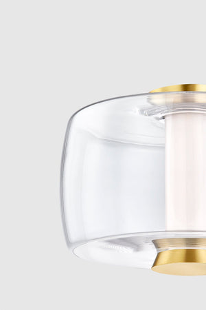 Close-up of the Beau Flush Mount in aged brass showing the shade profile and mounting canopy.
