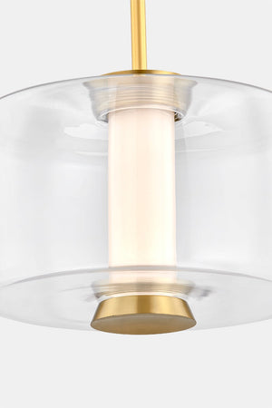 Close-up of the Beau Pendant 15" in aged brass showing the shade shape and metal detail.