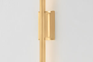 Close-up of the Bernard Wall Sconce in aged brass showing the arm curve and shade silhouette.