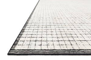 Side view of the Beverly Ivory / Black rug.