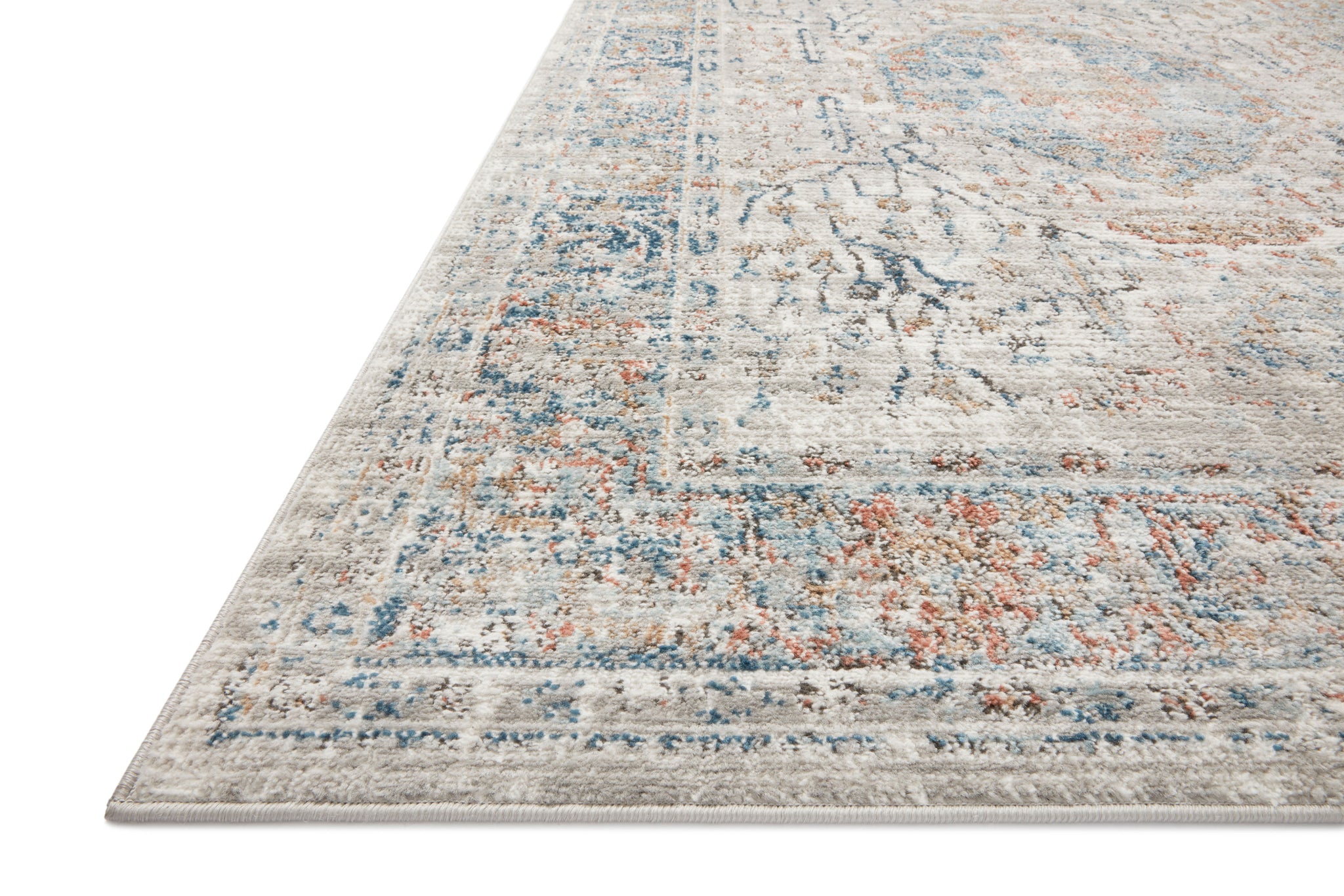 Side view of the Bianca Stone / Multi rug.