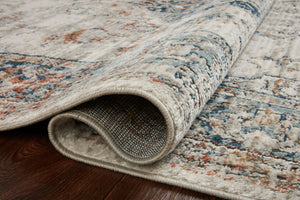 Side view of the Bianca Ivory / Ocean rug.