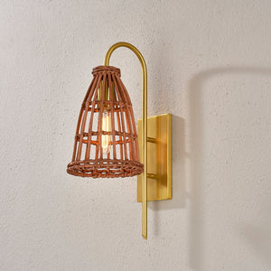 Close-up of the Jordan Wall Sconce in aged brass showing the arm curve and shade silhouette.