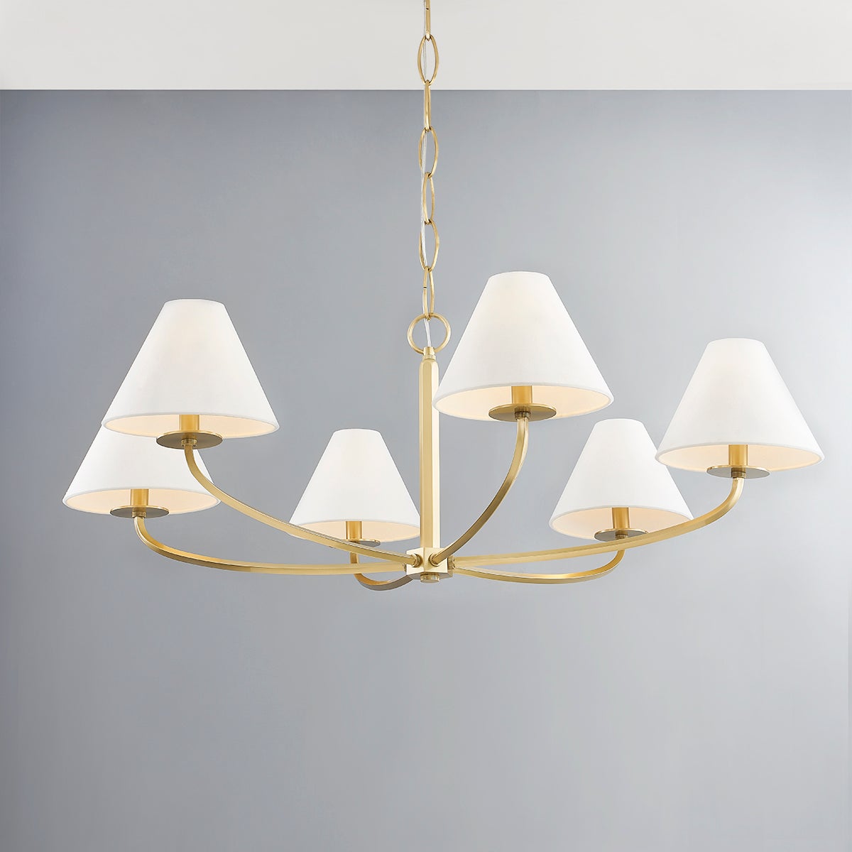 Close-up of the Stacey Chandelier 40.25" in aged brass showing the frame, arms, and shade detail.