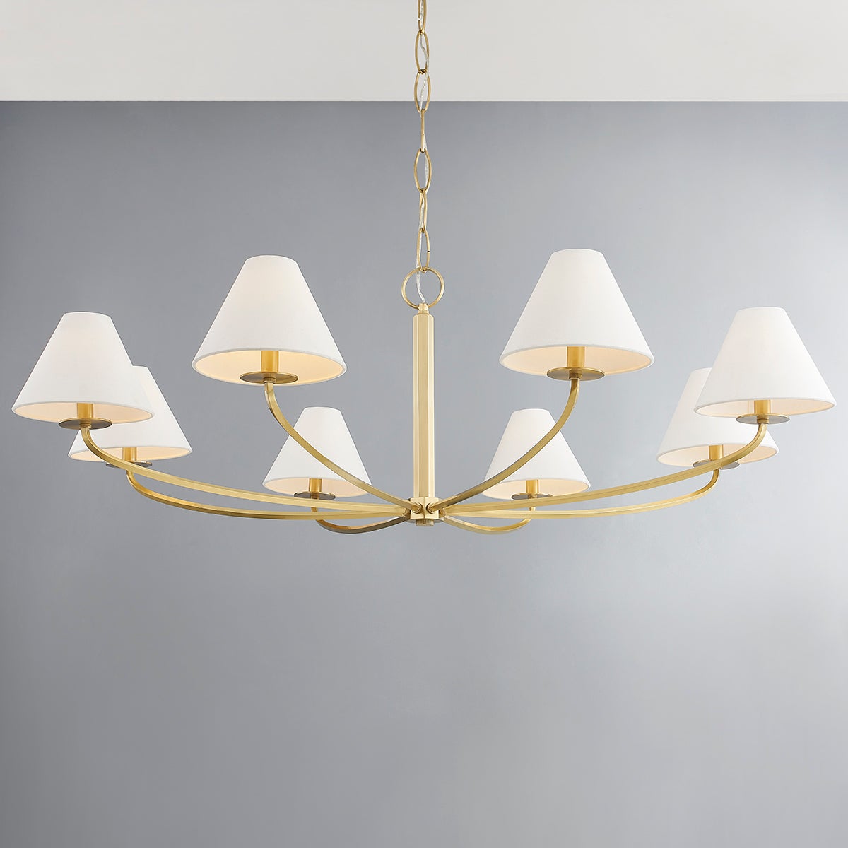 Close-up of the Stacey Chandelier 52.25" in aged brass showing the frame, arms, and shade detail.