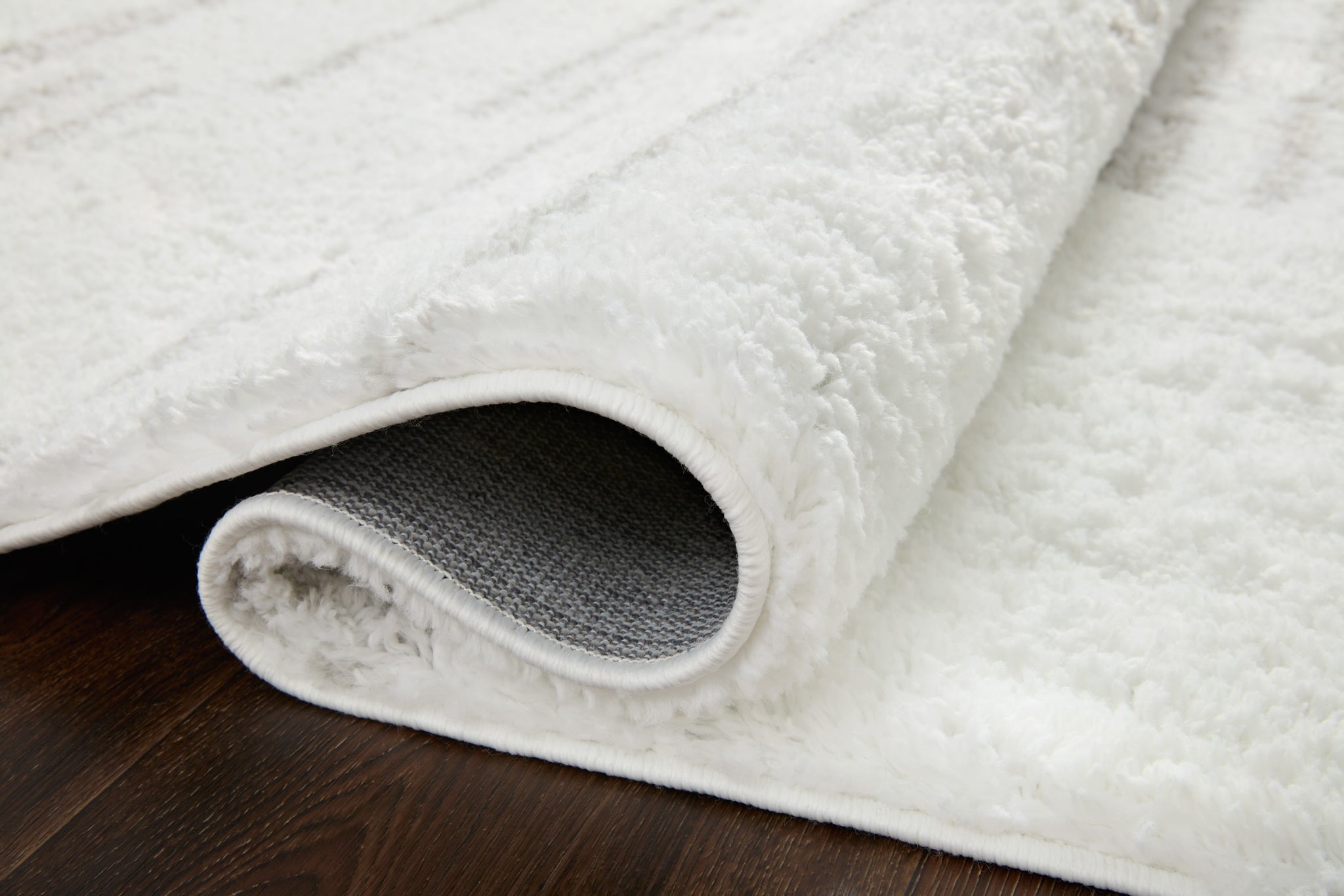 Close-up detail of the Bliss Shag White / Grey showing its pile and weave.