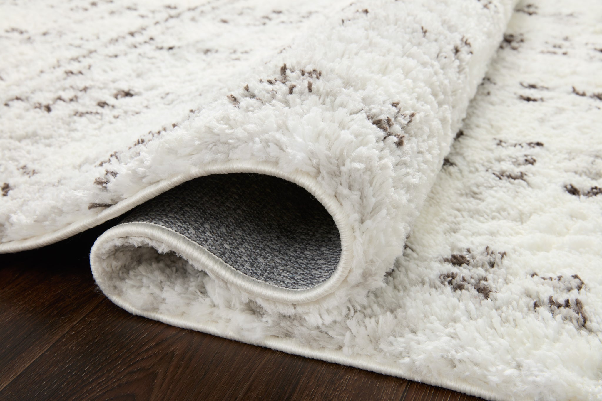 Close-up detail of the Bliss Shag Cream / Grey showing its pile and weave.