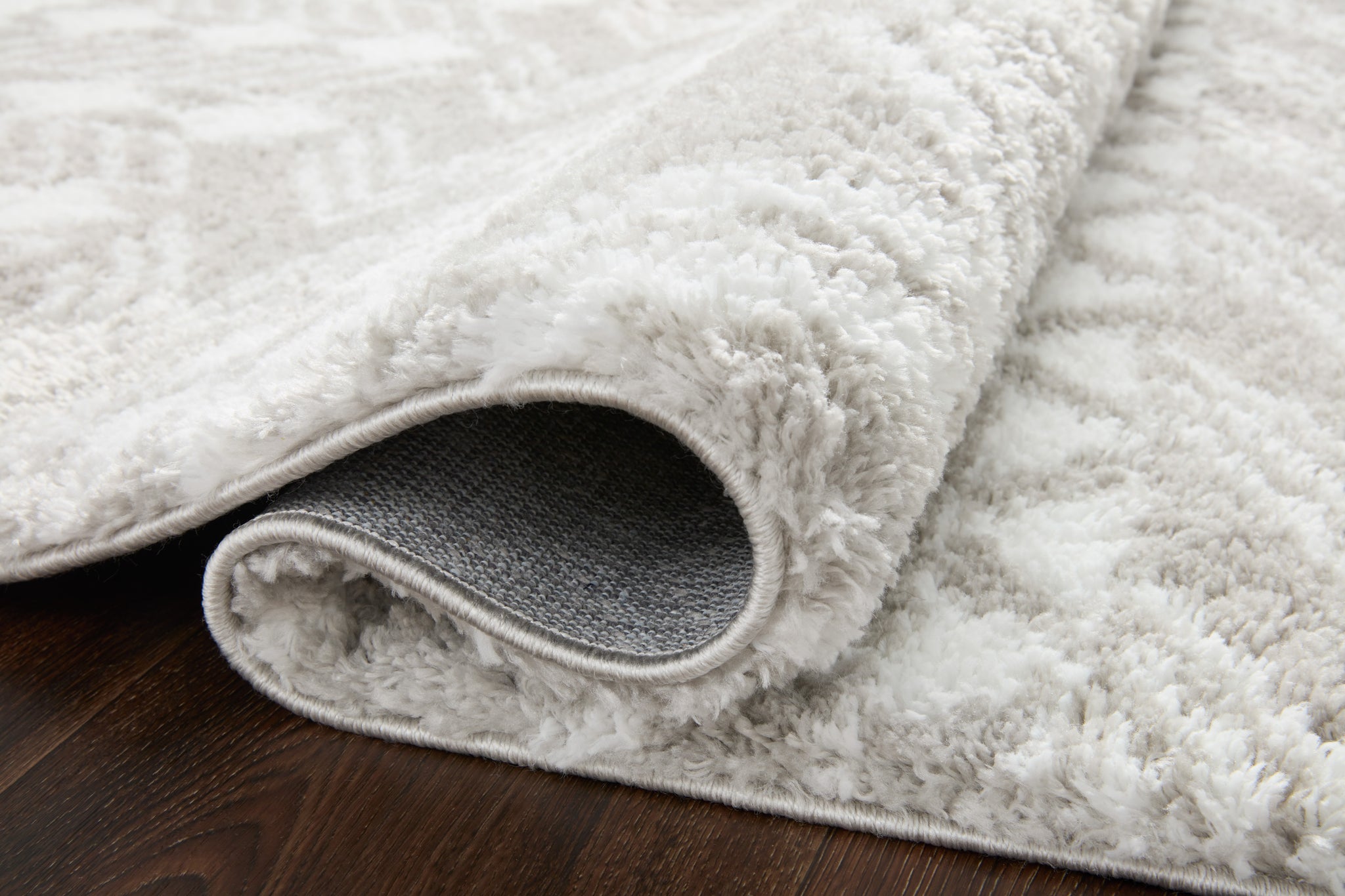 Close-up detail of the Bliss Shag Grey / White (Pattern 5) showing its pile and weave.