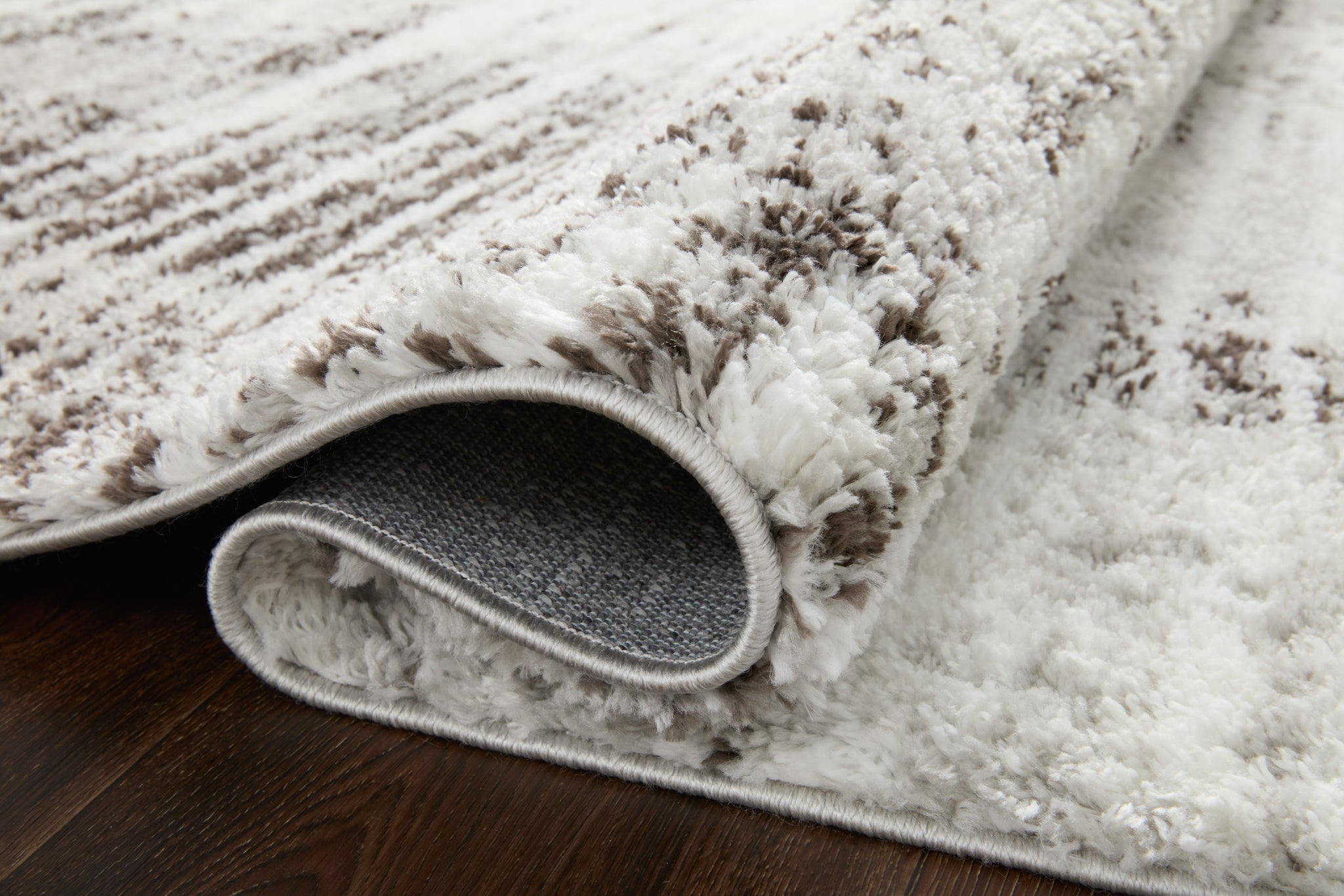 Close-up detail of the Bliss Shag Grey / Cream showing its pile and weave.