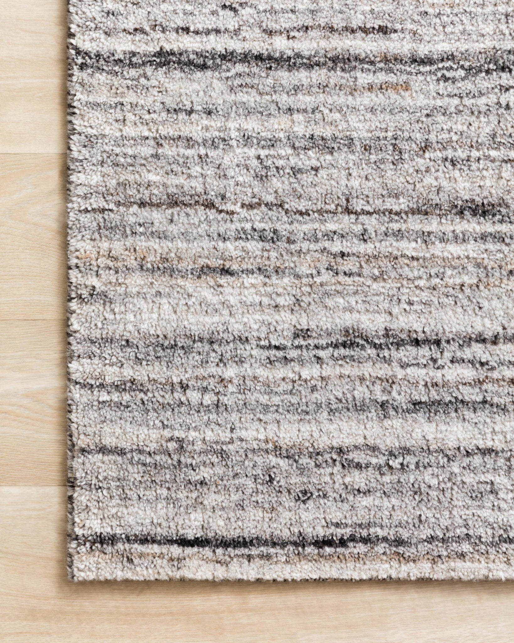 Side view of the Brandt Silver / Stone rug.
