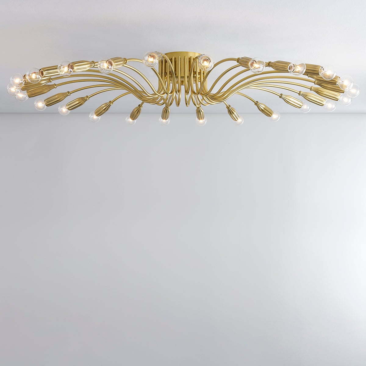 Barney Semi Flush 49.25" in aged brass — a Hudson Valley close-to-ceiling for hallways, bedrooms, and entryways at Laurie Yapp Home.